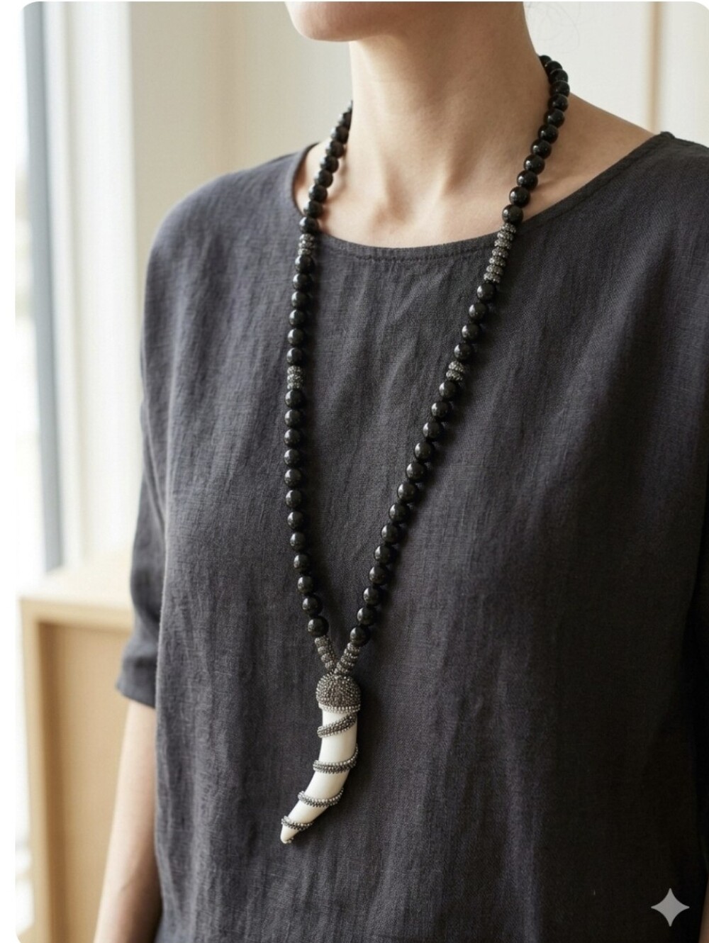 Elegant Black Bead Necklace with White Horn Pendant